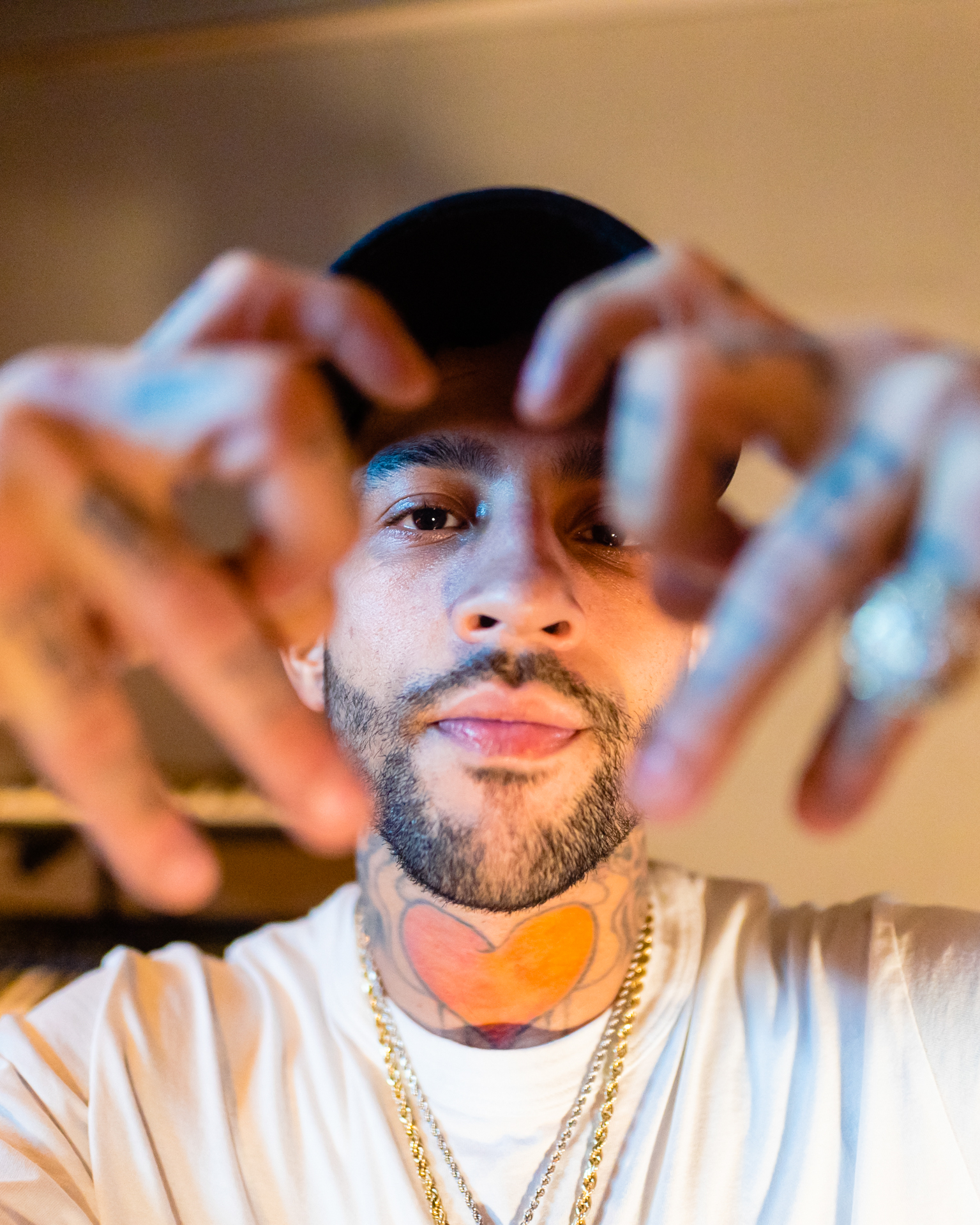 Man making hand symbols to the camera